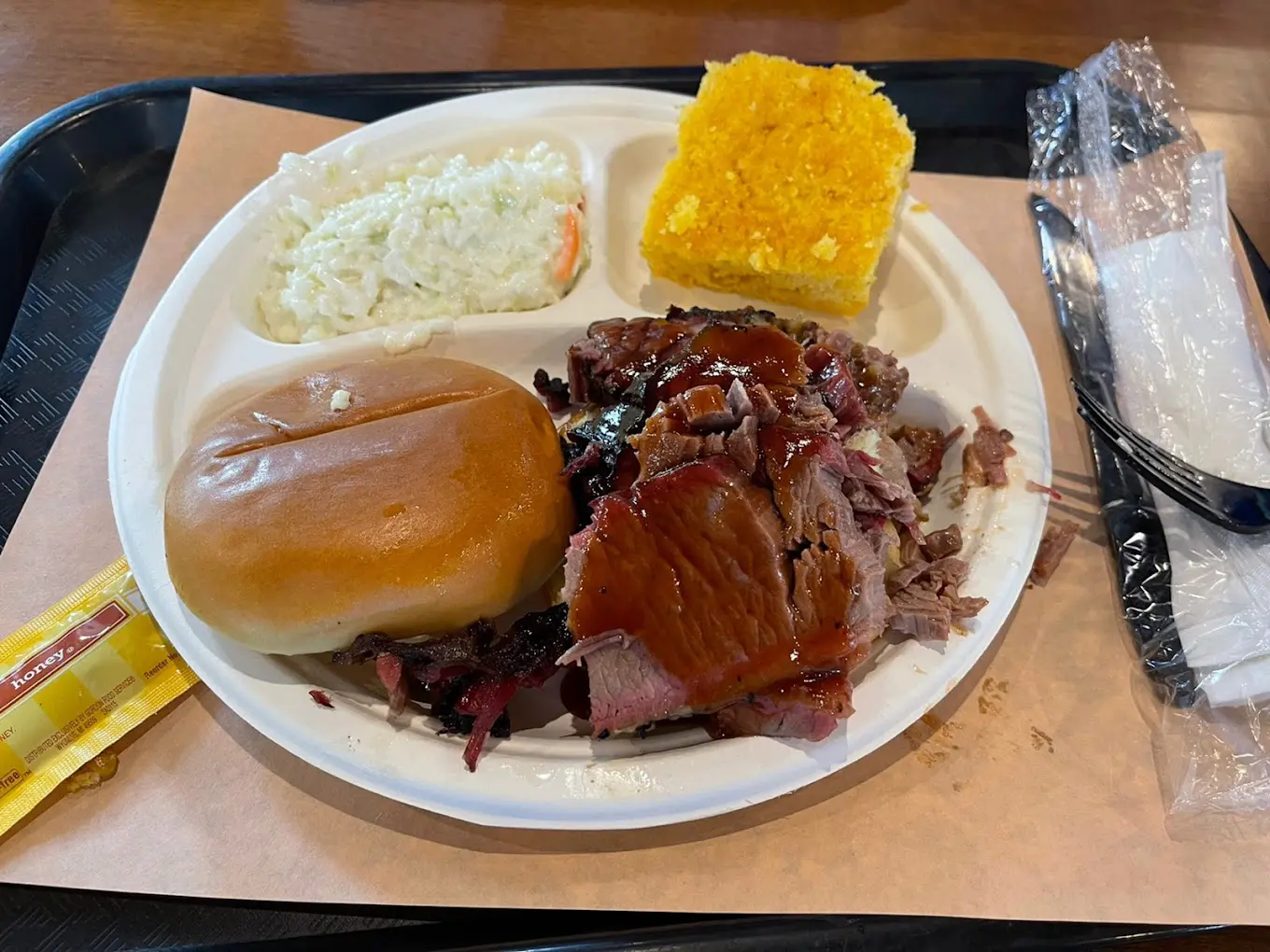 A plate of food with meat, potatoes and bread.