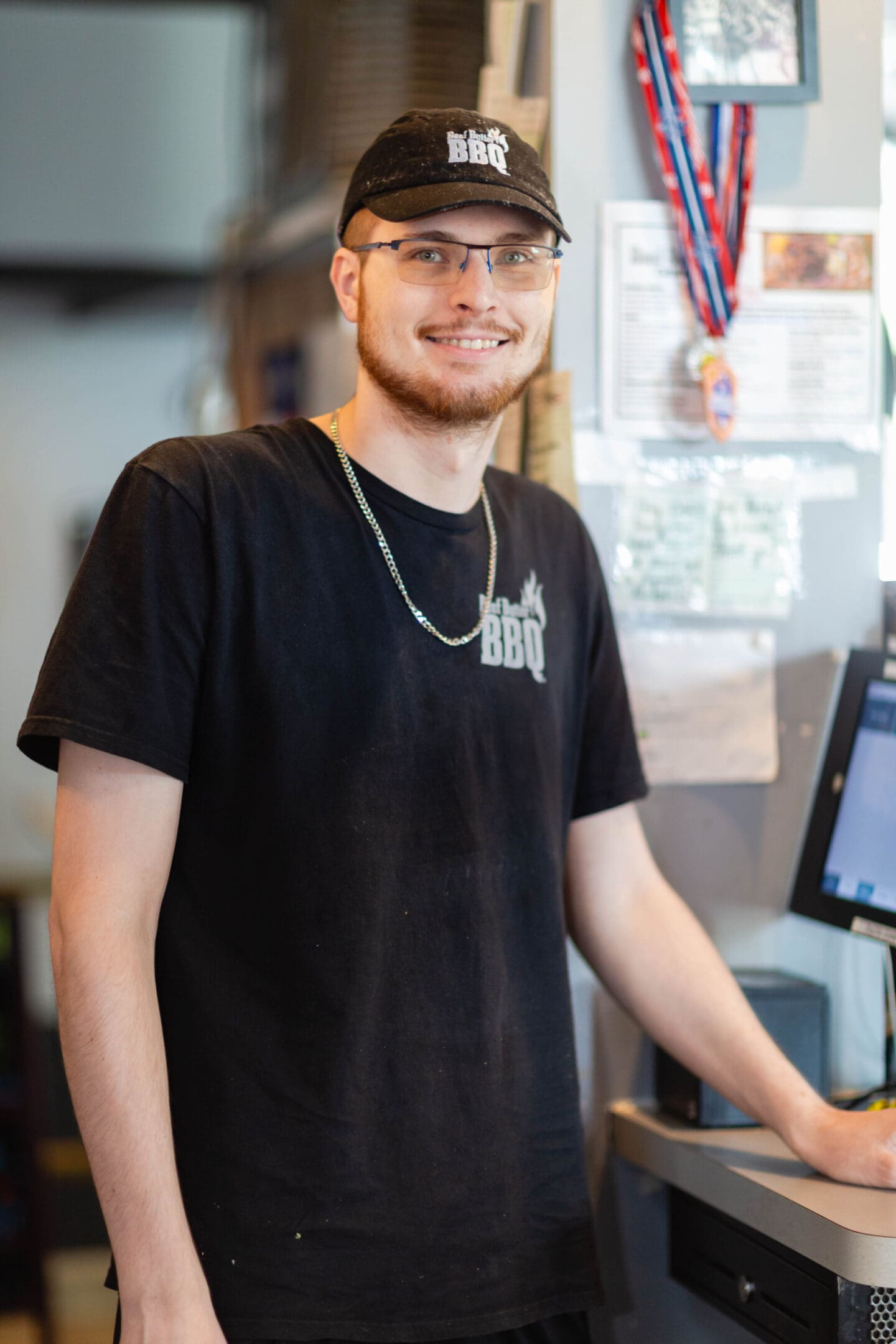 A man standing in front of a computer.