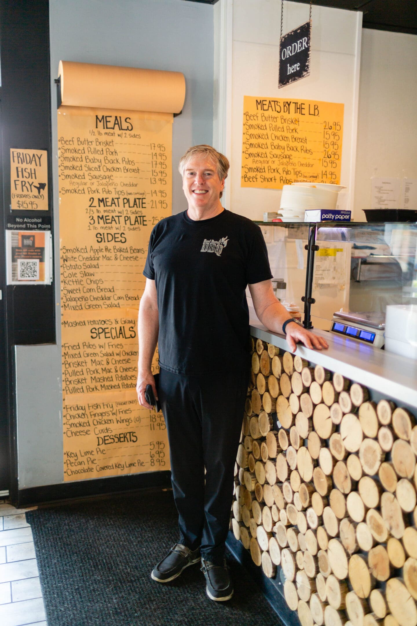 A man standing in front of a counter.