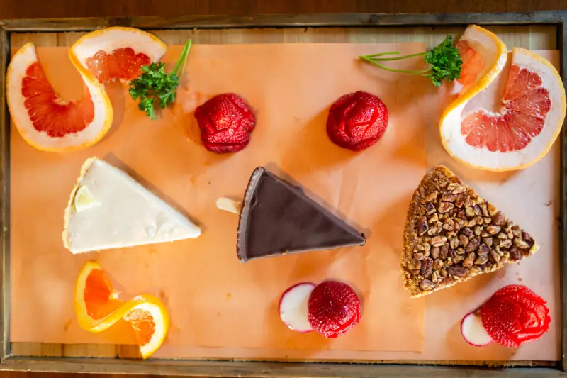 A wooden tray with some food on it