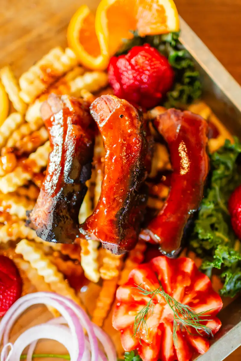 A plate of food with meat and vegetables.