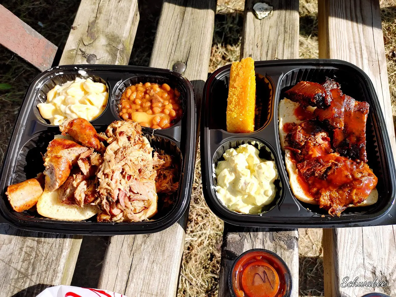 A couple of trays filled with different types of food.