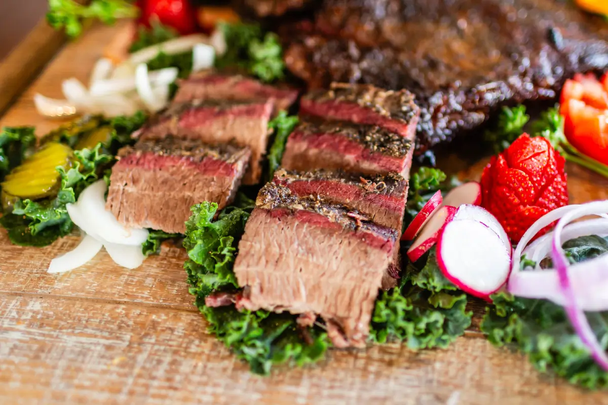 A close up of some meat on top of lettuce