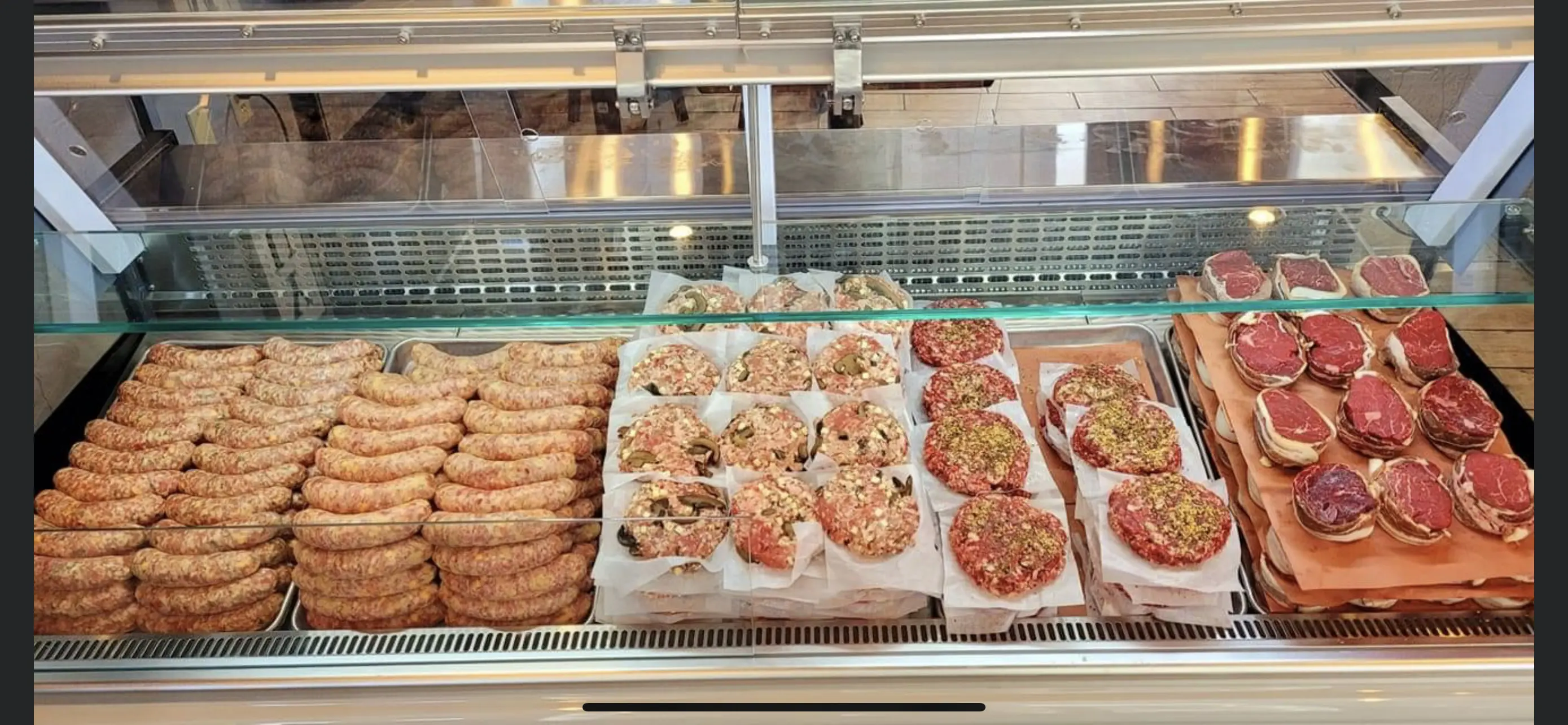 A display case filled with different types of food.